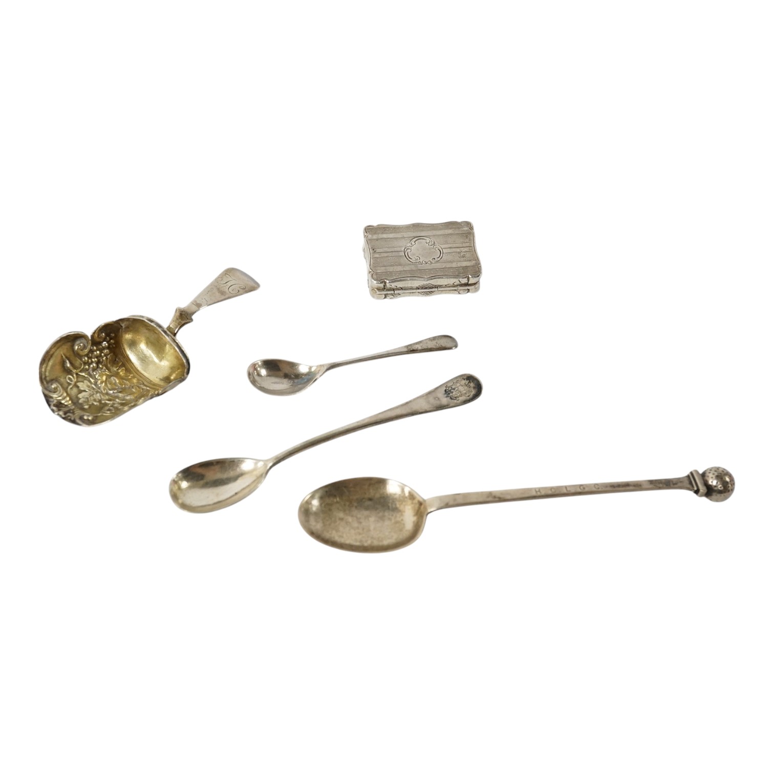 A Victorian silver shaped rectangular vinaigrette, engraved with a scene to commemorate The Great Exhibition at the Crystal Palace in Hyde Park, London, by William Dudley, Birmingham, 1850, 33mm, together with three smal